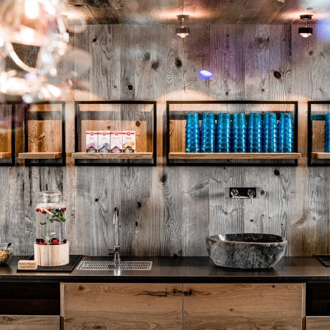 Buffet area with back wall and shelves made of solid wood by carpentery Weissteiner
