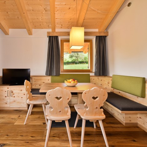 Living room furniture consisting of table, chairs, bench, chest of drawers made of solid wood.